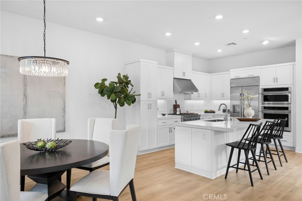 113 Bosal Irvine, CA 92618 - Photo 8 of 63 a kitchen with a table and chairs