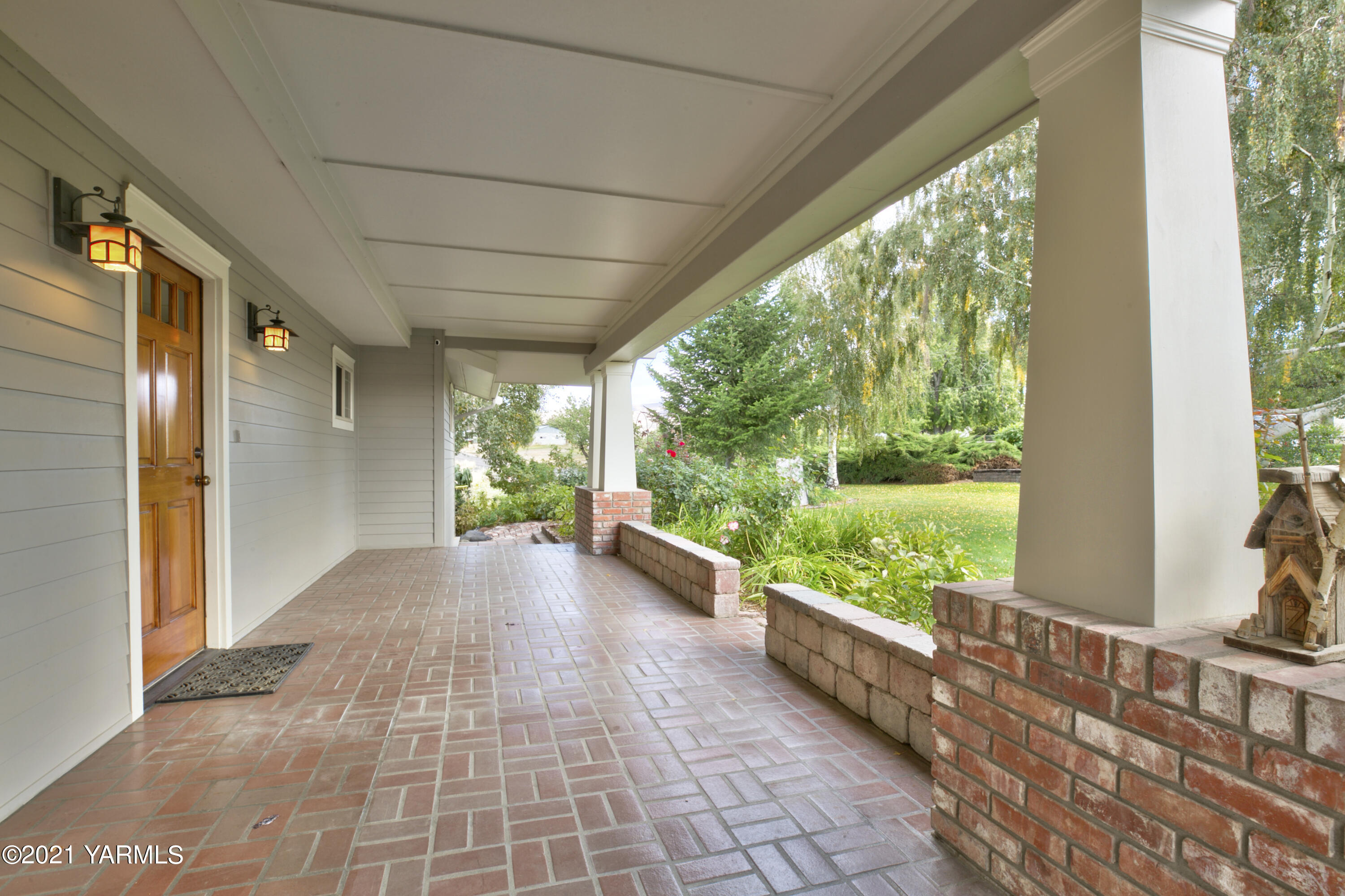 350 Hoff Road Moxee, WA 98936 - Photo 3 of 38 a view of a porch with wooden floor and outdoor space