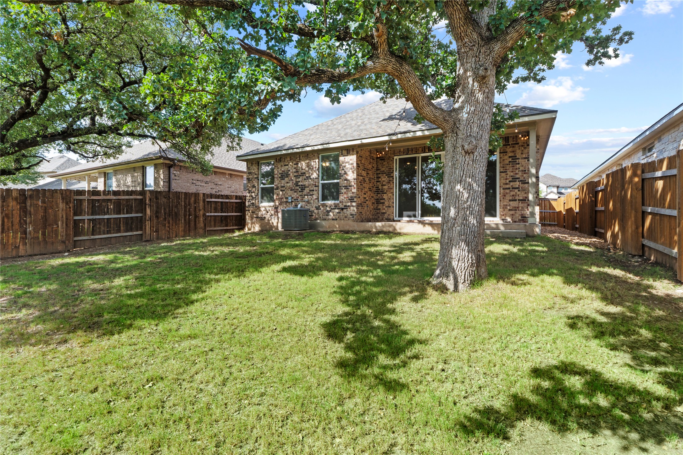341 Peace Pipe Way Georgetown, TX 78628 - Photo 25 of 28 Full sod and sprinkler on this greenbelt lot.