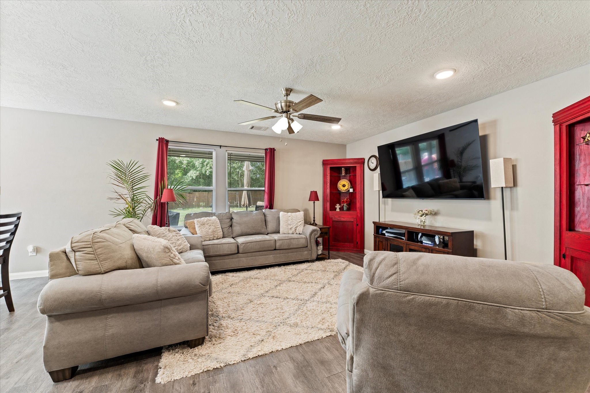 3998 Frontier Road Willis, TX 77378 - Photo 15 of 33 a living room with furniture and a flat screen tv