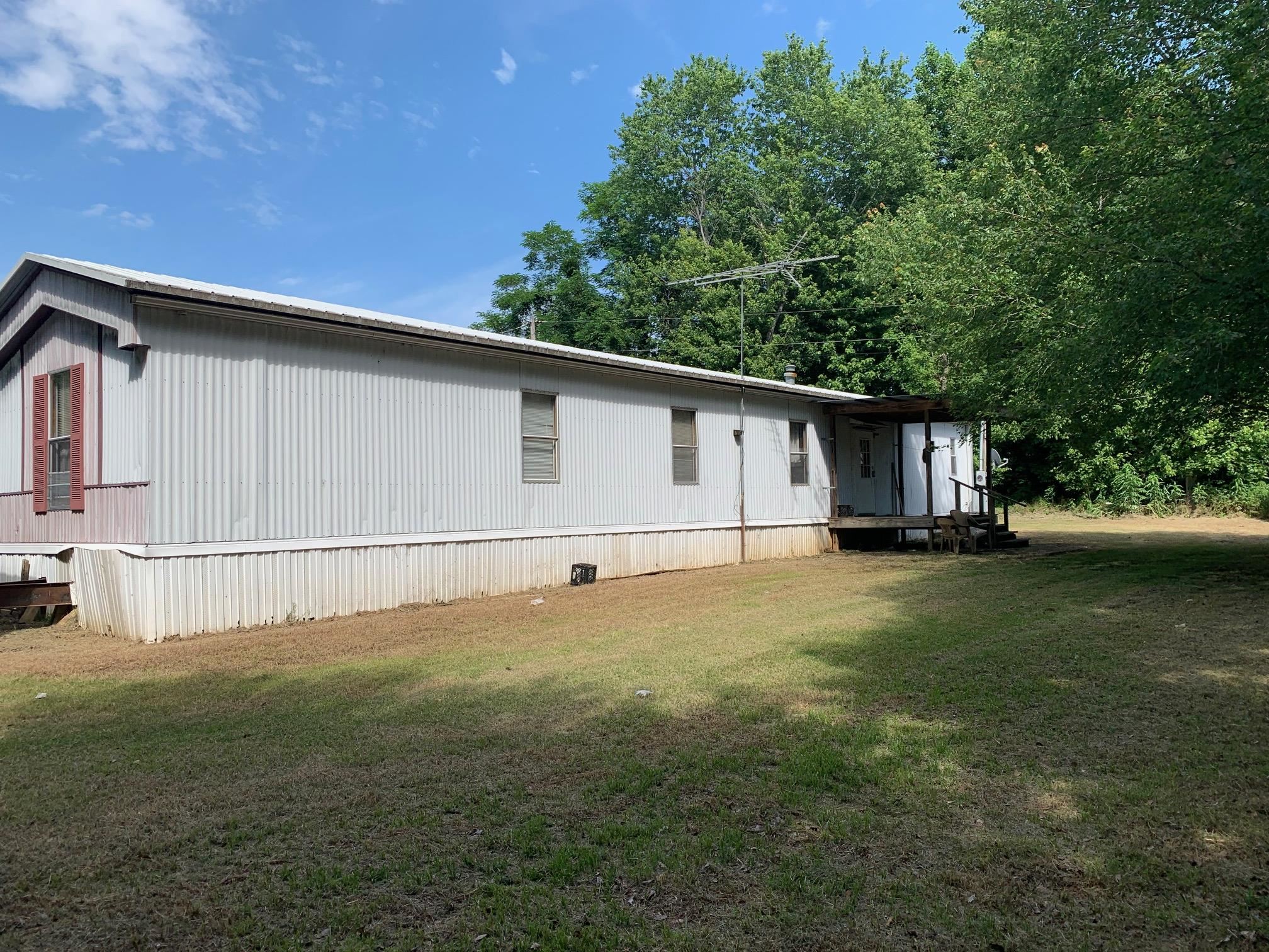 3231 Curve Woodville Road Ripley, TN 38063 - Photo 3 of 15 a view of a backyard with large trees