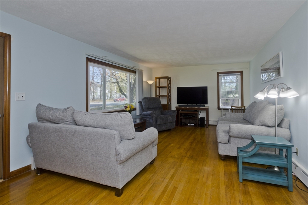 460 James Street Chicopee, MA 01020 - Photo 13 of 34 a living room with furniture and a flat screen tv