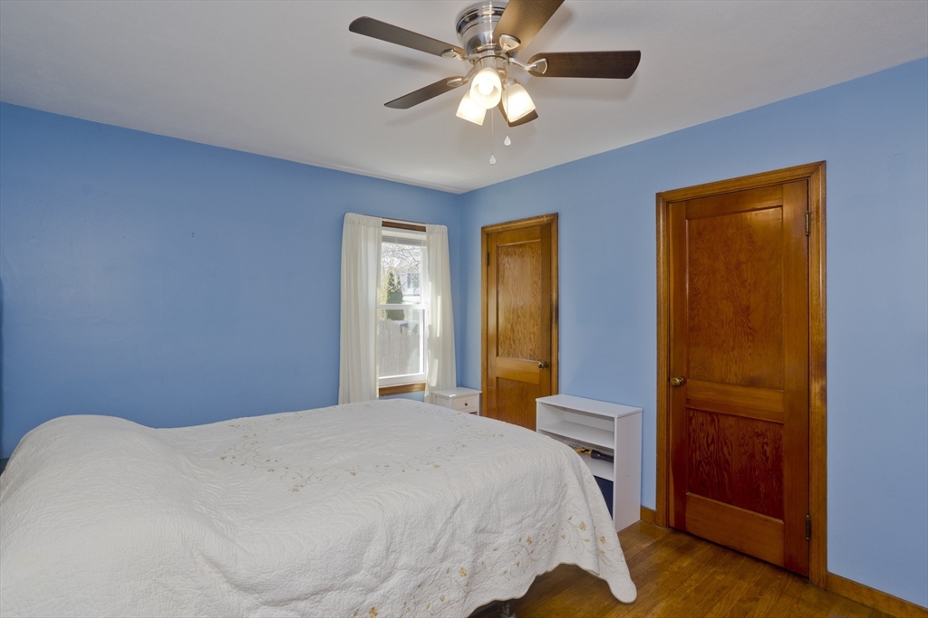 460 James Street Chicopee, MA 01020 - Photo 21 of 34 a bedroom with a bed and a chandelier