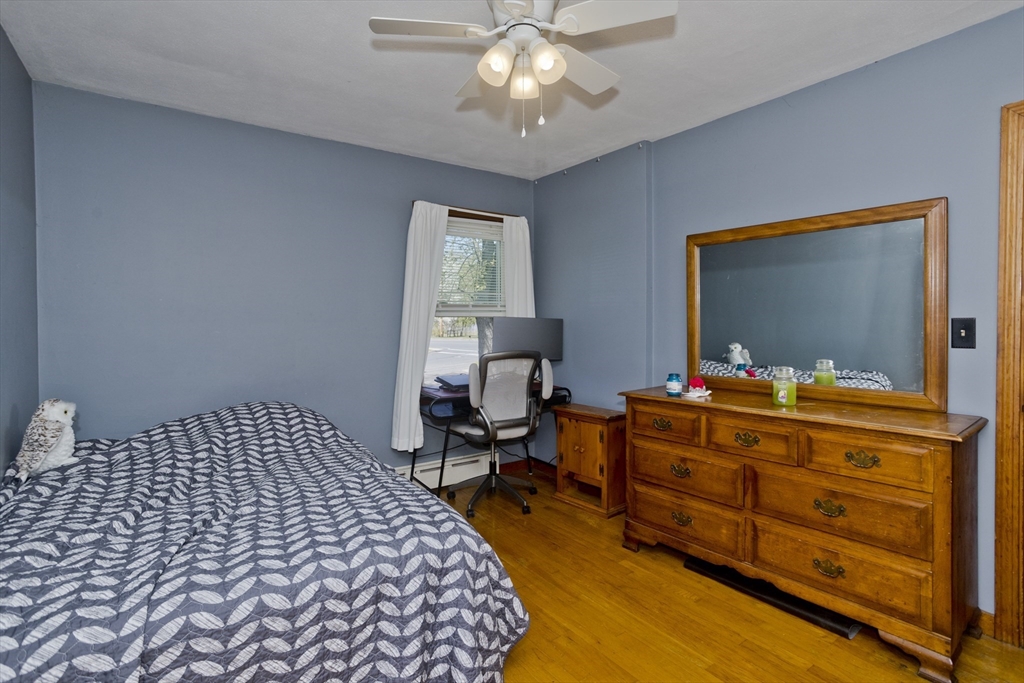 460 James Street Chicopee, MA 01020 - Photo 22 of 34 a bedroom with a bed and wooden floor