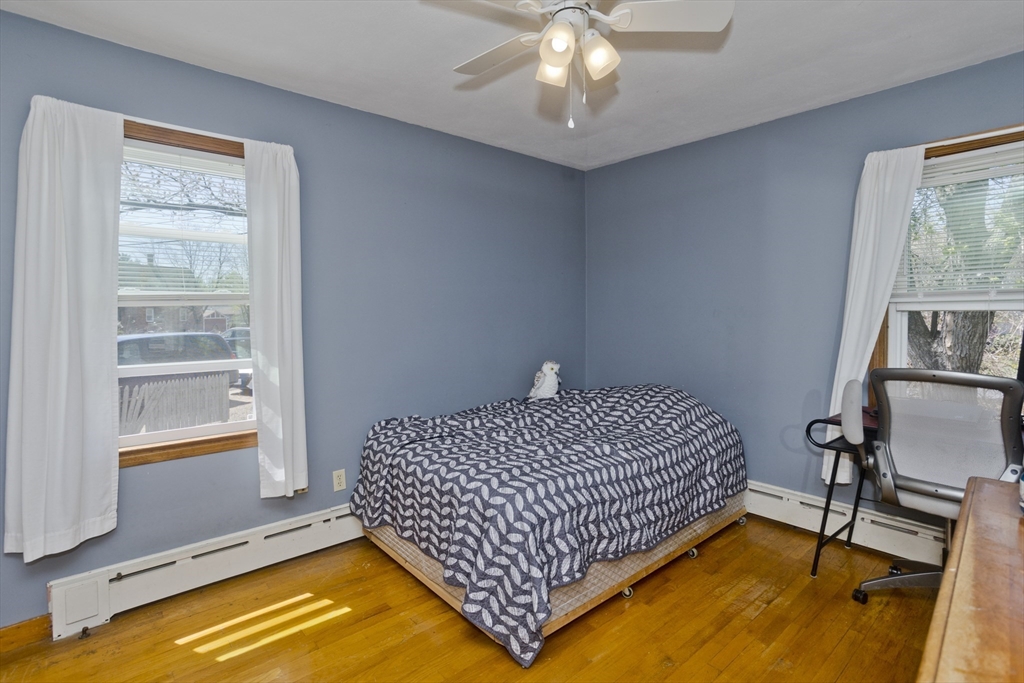 460 James Street Chicopee, MA 01020 - Photo 24 of 34 a bed sitting in a bedroom next to a window