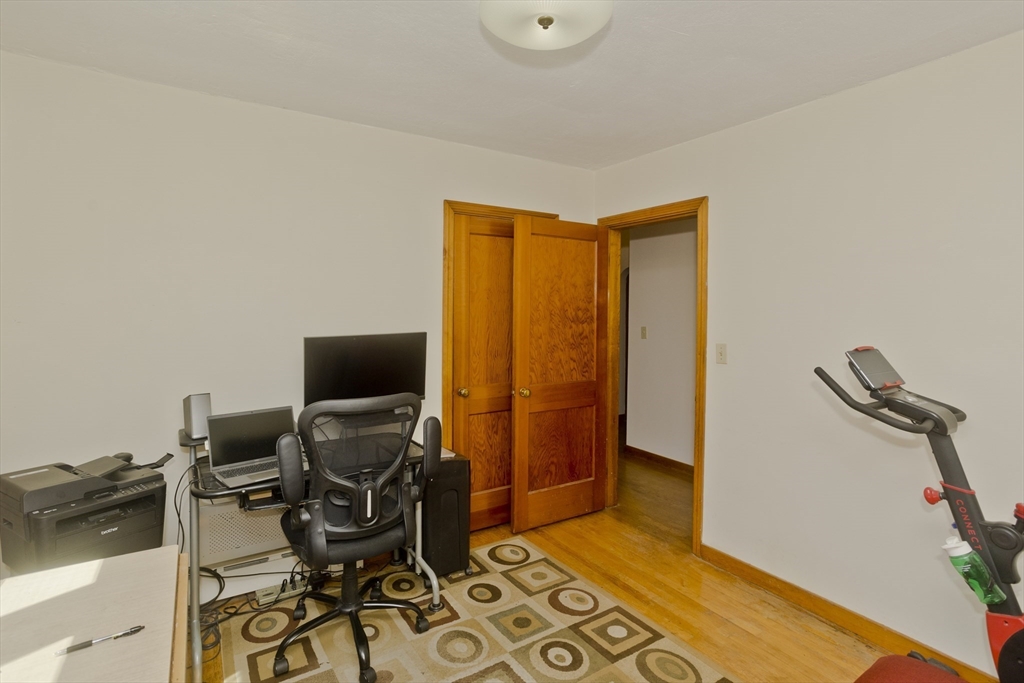460 James Street Chicopee, MA 01020 - Photo 27 of 34 a view of workspace with wooden floor windows