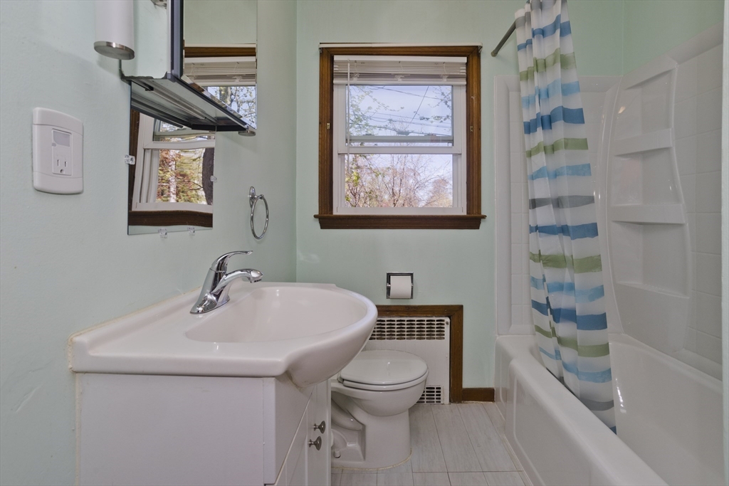 460 James Street Chicopee, MA 01020 - Photo 28 of 34 a bathroom with a toilet a sink and mirror