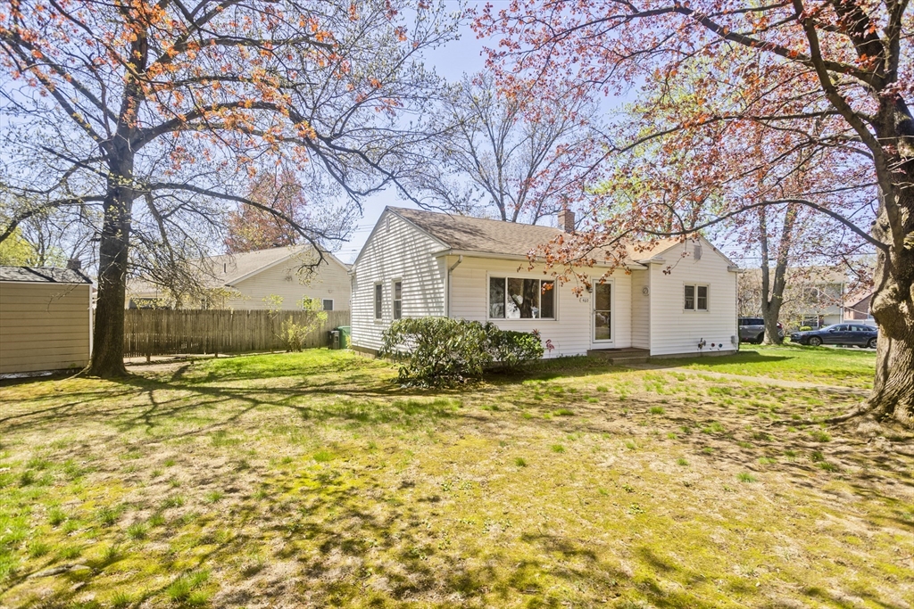 460 James Street Chicopee, MA 01020 - Photo 3 of 34 a view of a white house with a yard