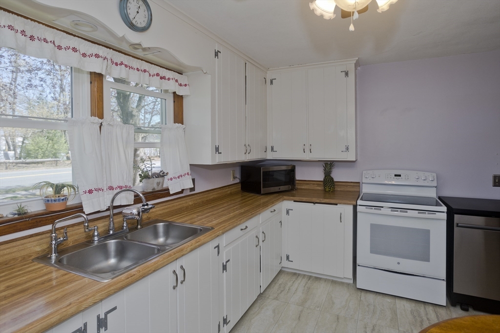 460 James Street Chicopee, MA 01020 - Photo 7 of 34 a view of a kitchen with sink and cabinets
