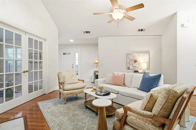 a living room with furniture and a rug