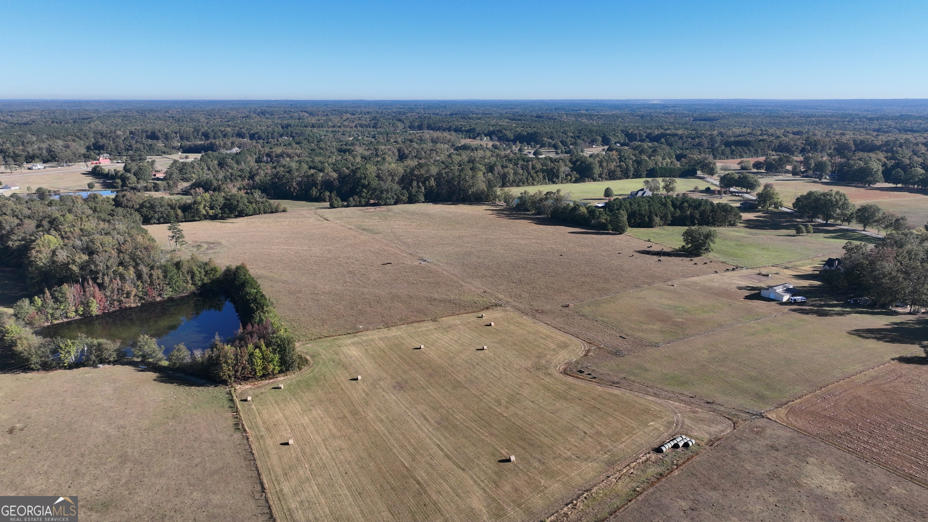 Lot 6 Mask Road Brooks, GA 30205 - Photo 9 of 10 an aerial view of a house with a yard and lake view