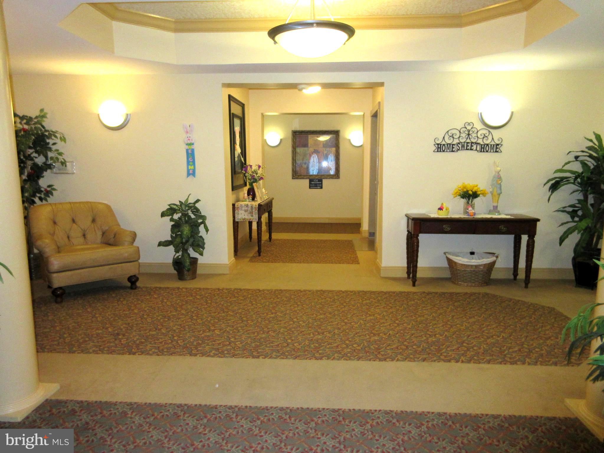 8601 Roaming Ridge Way, Unit 105 Odenton, MD 21113 - Photo 3 of 50 View walking into building