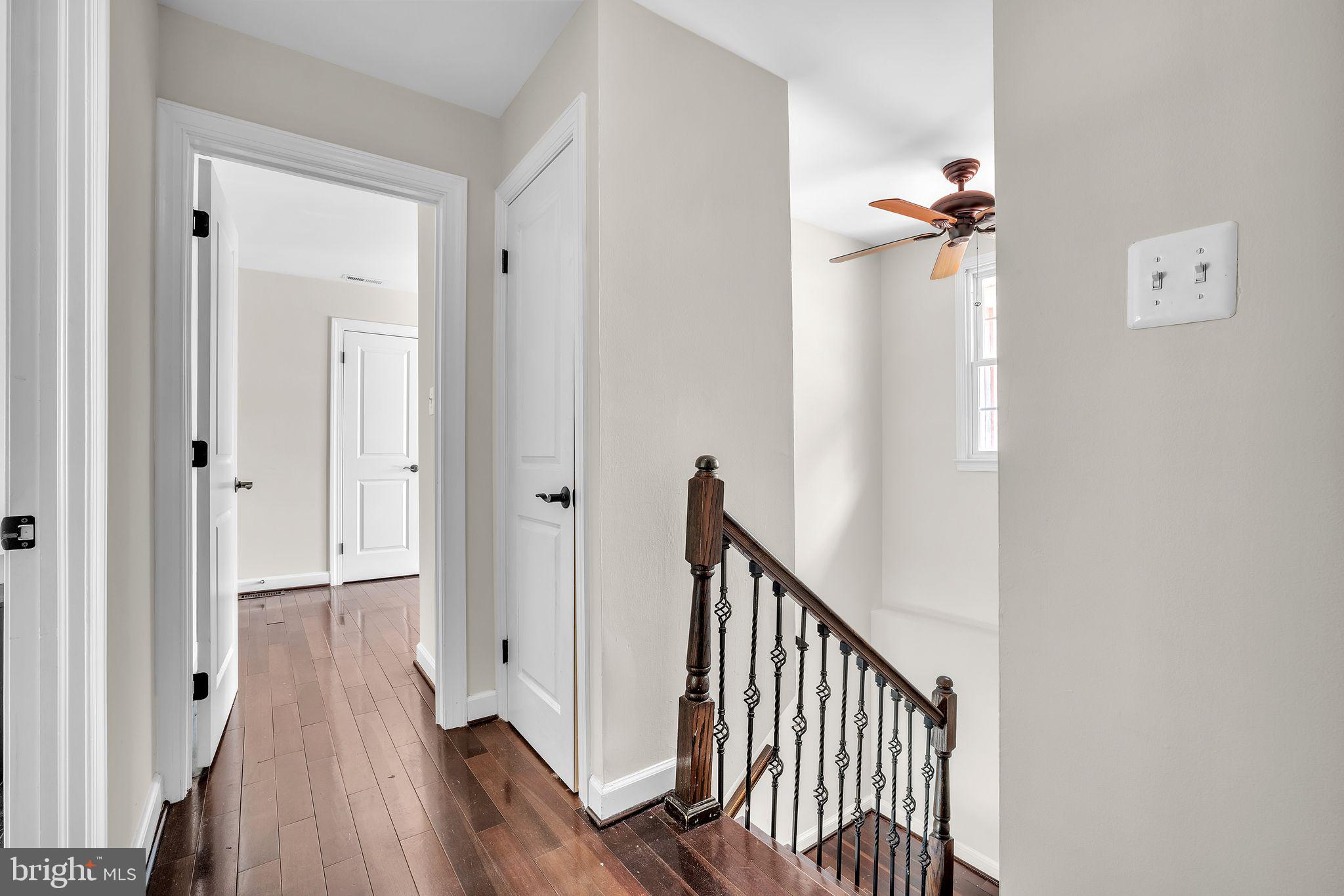 5255 Pumphrey Drive Fairfax, VA 22032 - Photo 14 of 38 a view of a hallway with wooden floor and staircase