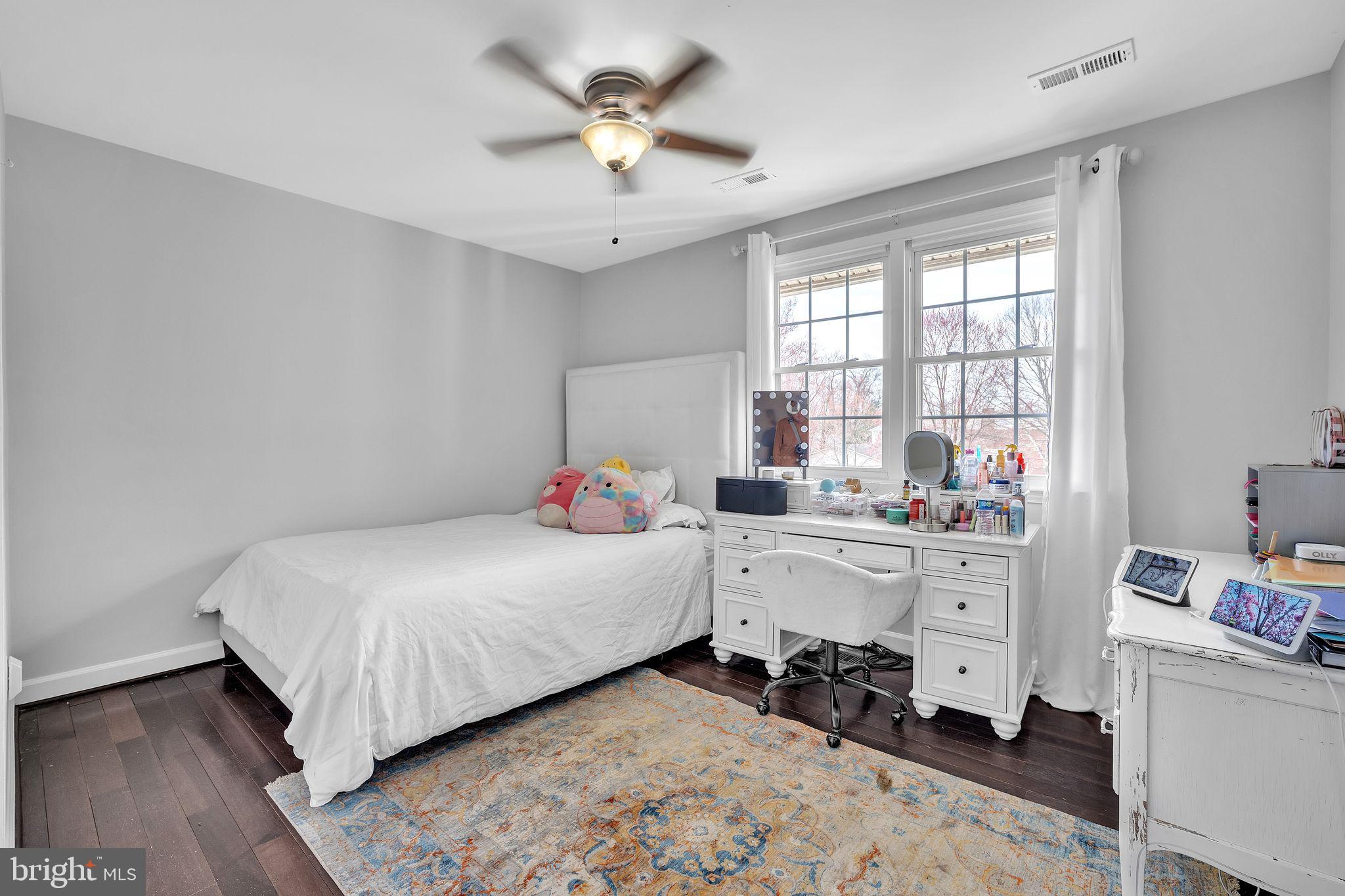 5255 Pumphrey Drive Fairfax, VA 22032 - Photo 17 of 38 a room with a bed and a chandelier