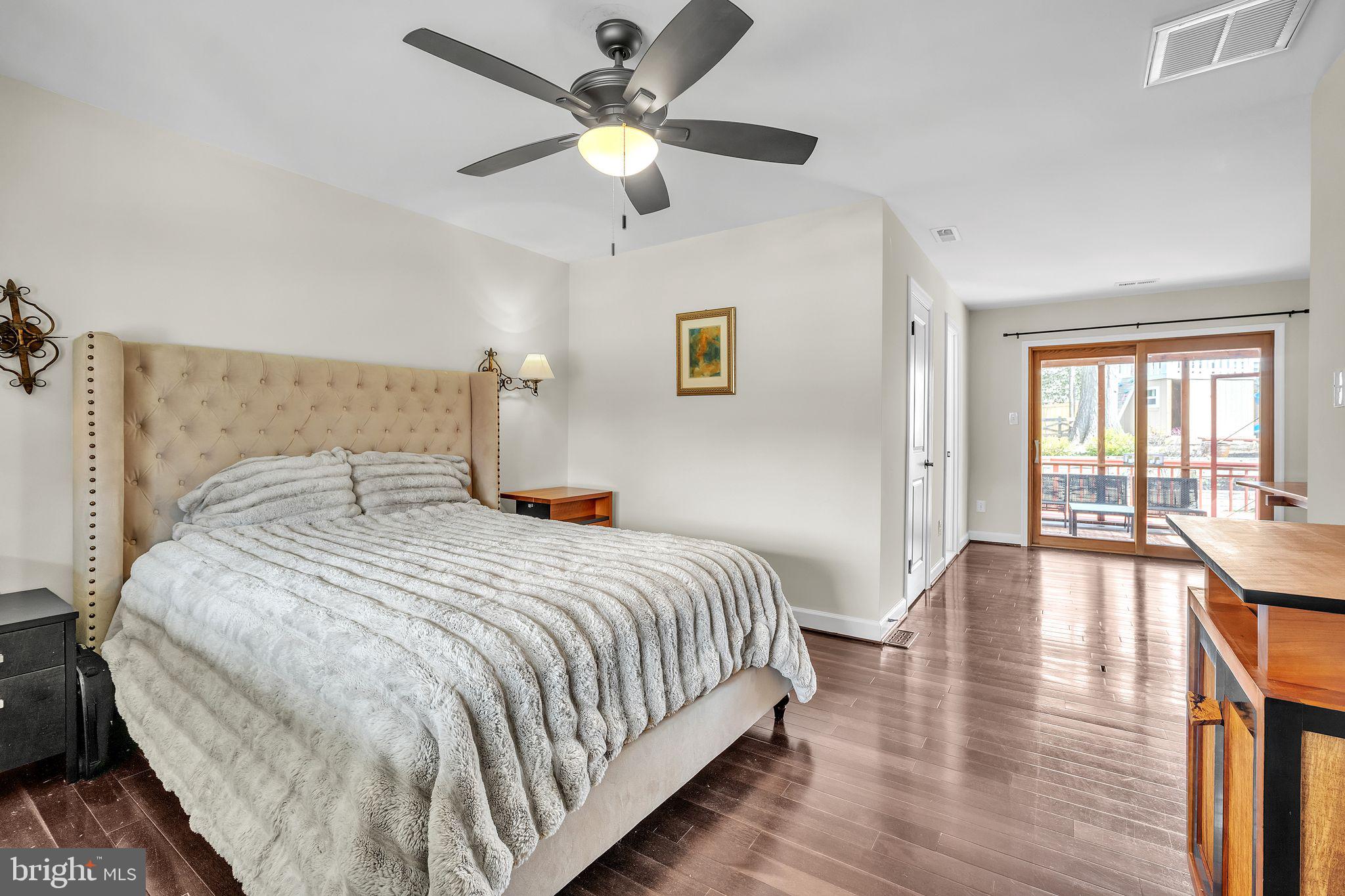 5255 Pumphrey Drive Fairfax, VA 22032 - Photo 19 of 38 a bedroom with a large bed and a chandelier