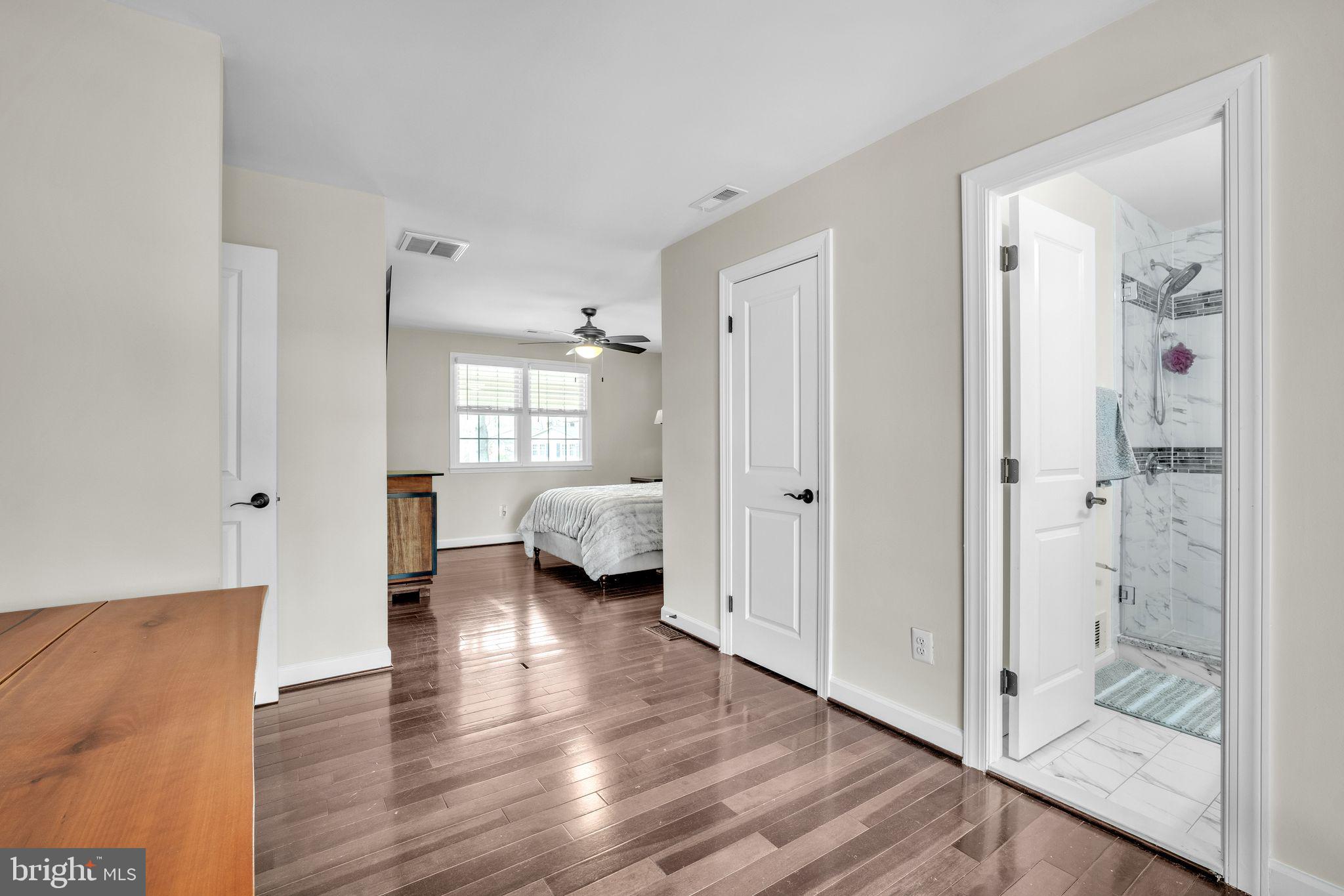 5255 Pumphrey Drive Fairfax, VA 22032 - Photo 21 of 38 a view of a bedroom with a bed and glass door