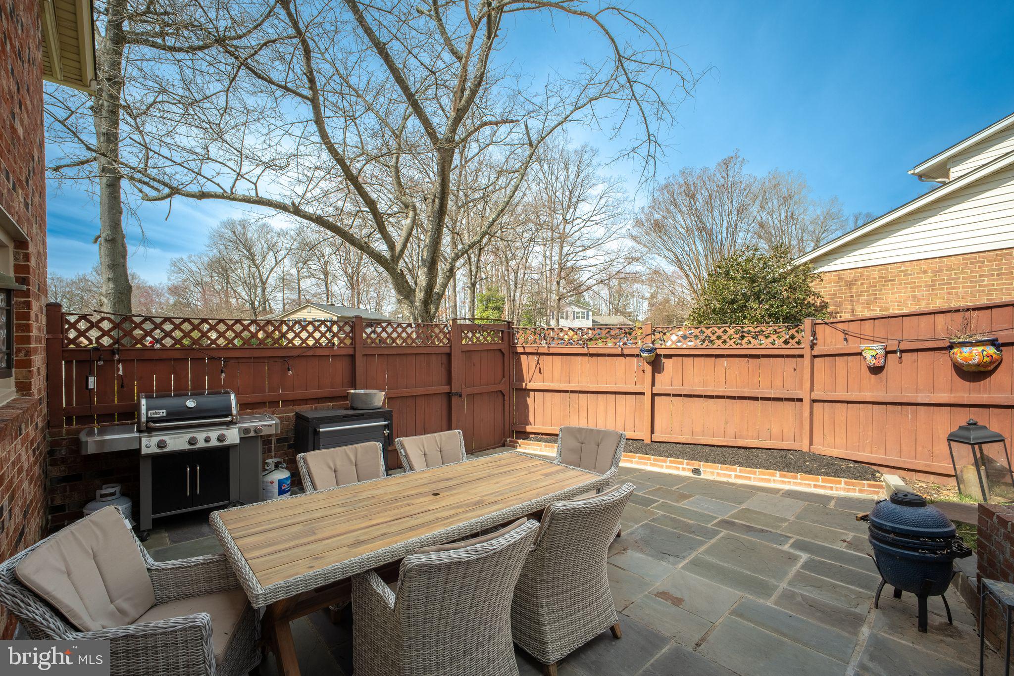 5255 Pumphrey Drive Fairfax, VA 22032 - Photo 26 of 38 a view of a patio with a table and chairs