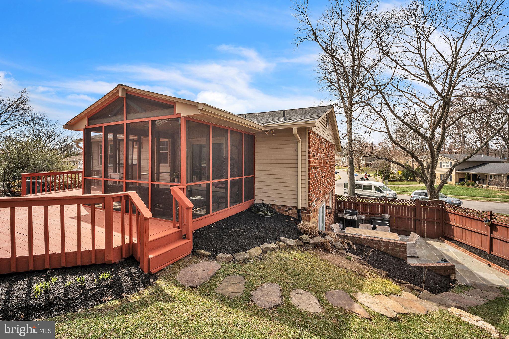 5255 Pumphrey Drive Fairfax, VA 22032 - Photo 29 of 38 a view of a house with a yard wooden fence and a floor to ceiling window
