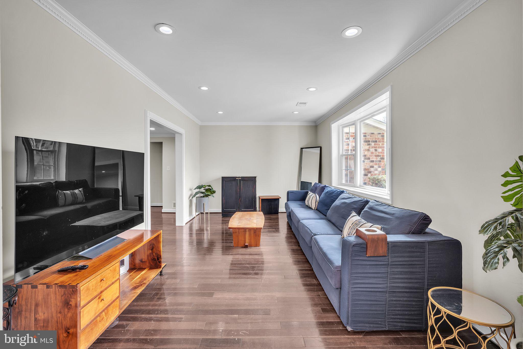5255 Pumphrey Drive Fairfax, VA 22032 - Photo 6 of 38 a living room with furniture and a flat screen tv