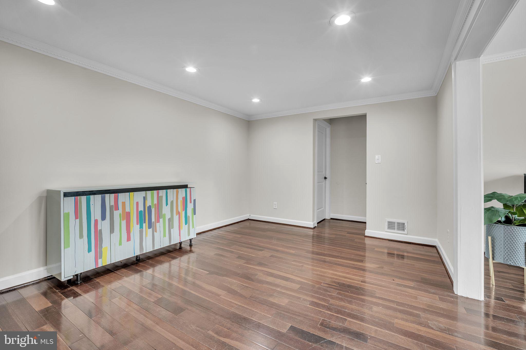5255 Pumphrey Drive Fairfax, VA 22032 - Photo 7 of 38 a view of an empty room with wooden floor and a window
