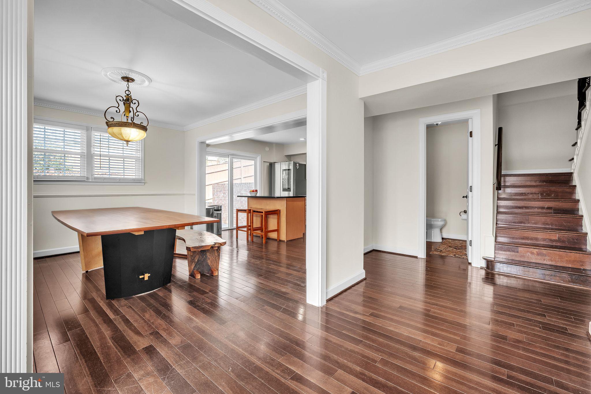 5255 Pumphrey Drive Fairfax, VA 22032 - Photo 8 of 38 a view of a livingroom with wooden floor and a ceiling fan