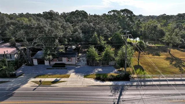an aerial view of residential houses and outdoor space
