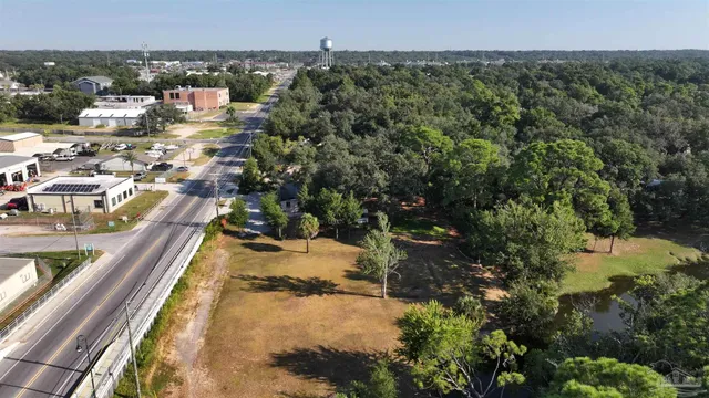 a view of a park with large trees