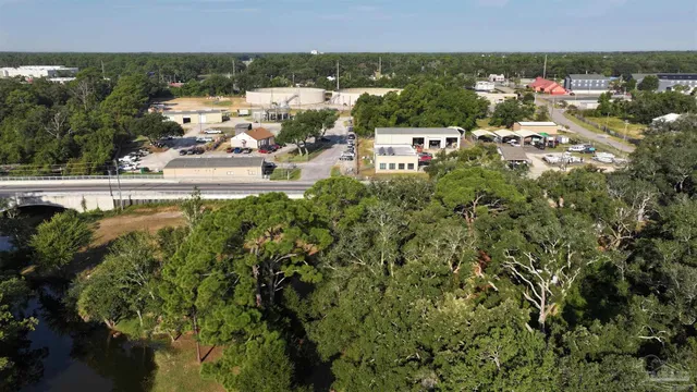 a view of a yard with a tree