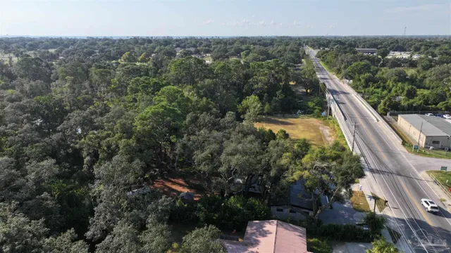 a view of outdoor space with playground and green space