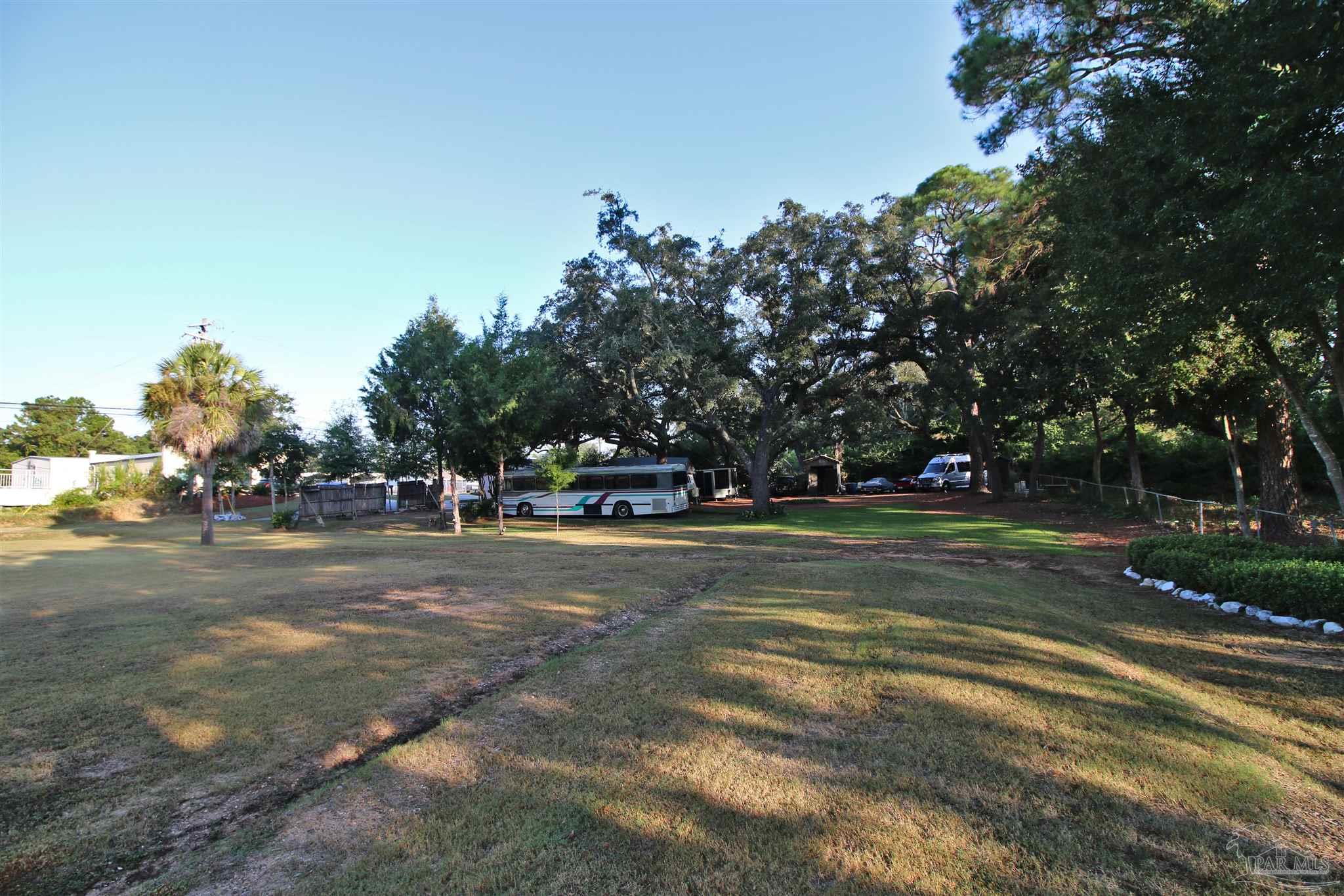 610 South Old Corry Field Road Pensacola, FL 32507 - Photo 38 of 72 a view of a playground with basketball court