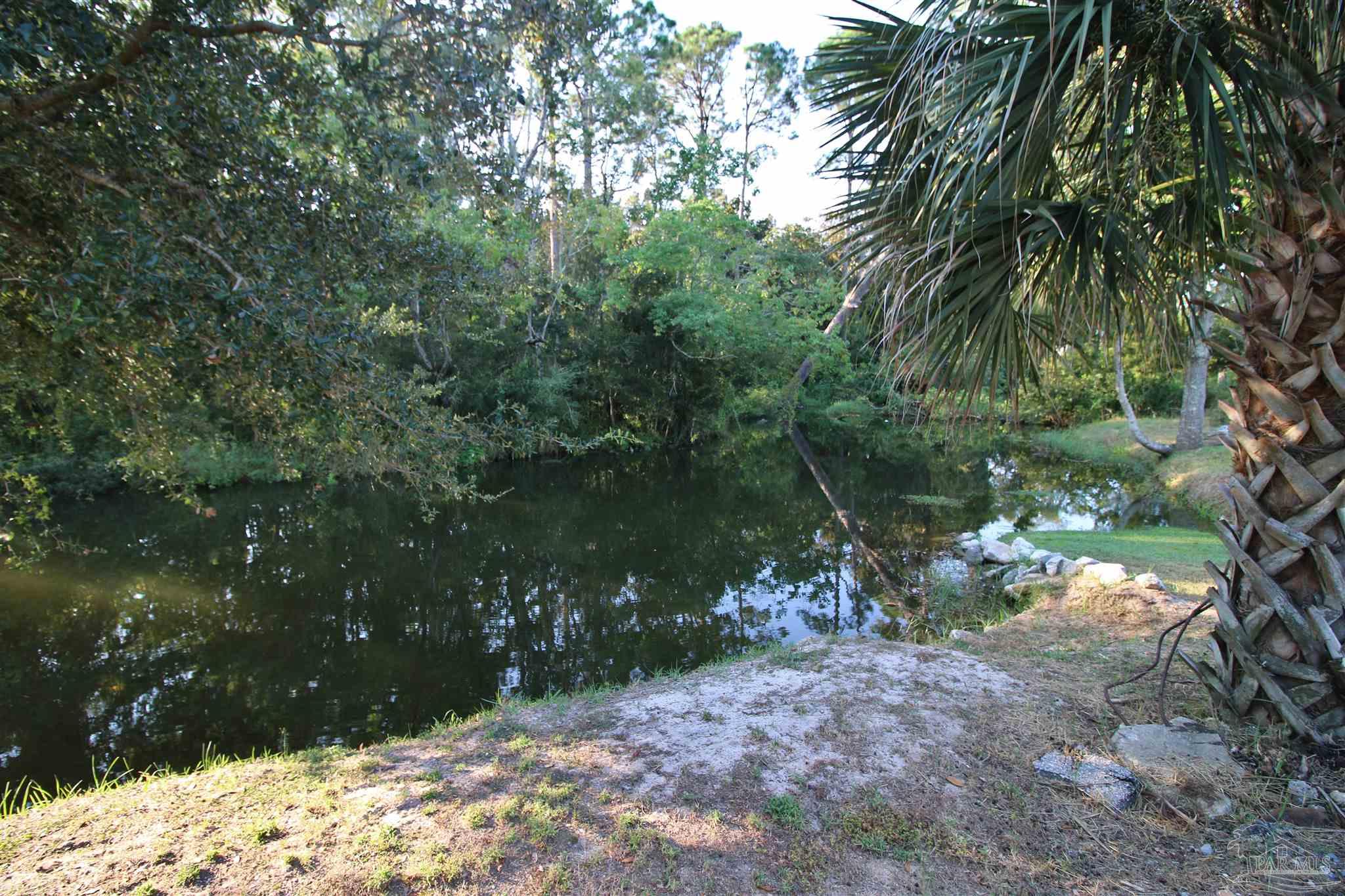 610 South Old Corry Field Road Pensacola, FL 32507 - Photo 39 of 72 a view of a yard with a tree