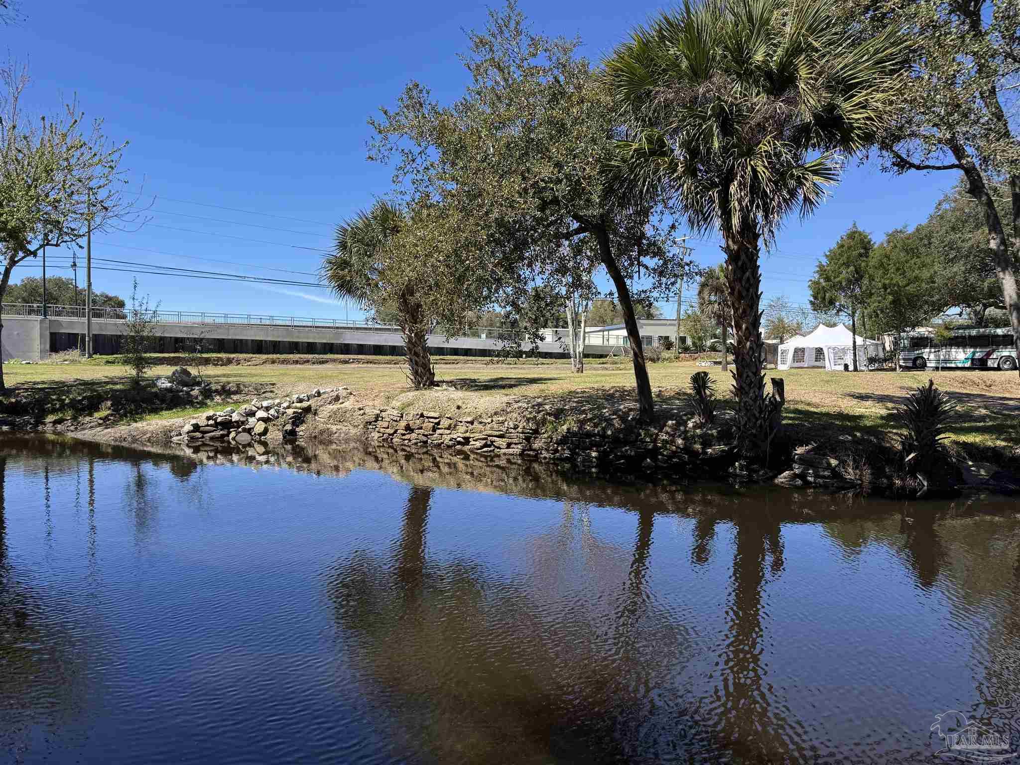 610 South Old Corry Field Road Pensacola, FL 32507 - Photo 4 of 72 a view of a lake with a house in the background