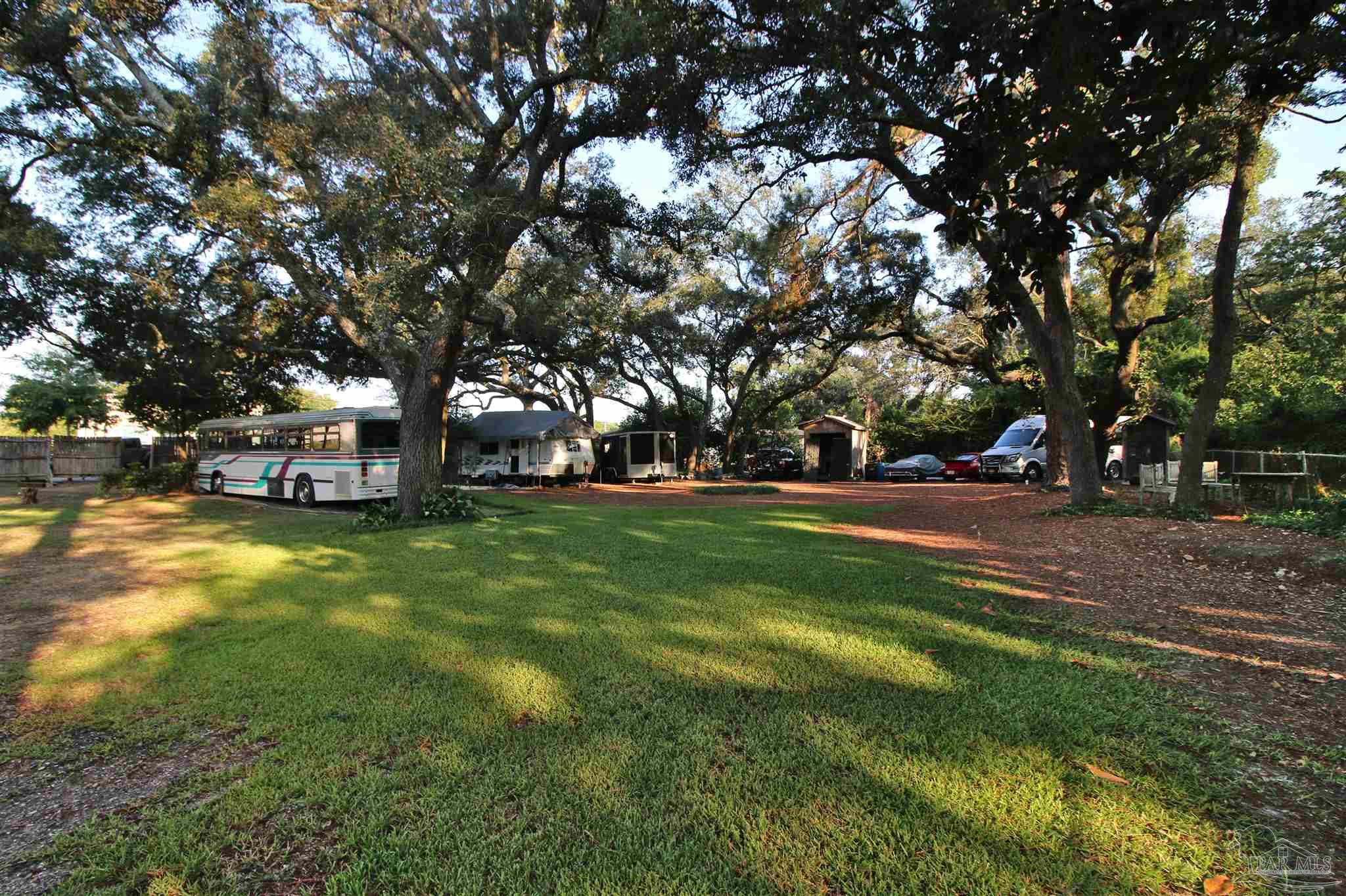 610 South Old Corry Field Road Pensacola, FL 32507 - Photo 41 of 72 a view of outdoor space with playground and green space