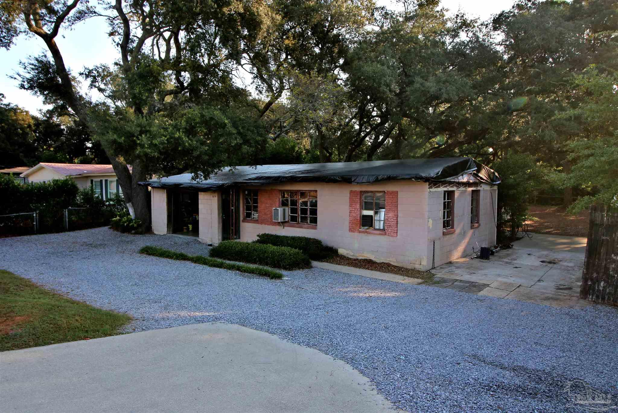 610 South Old Corry Field Road Pensacola, FL 32507 - Photo 50 of 72 a front view of a house with garden