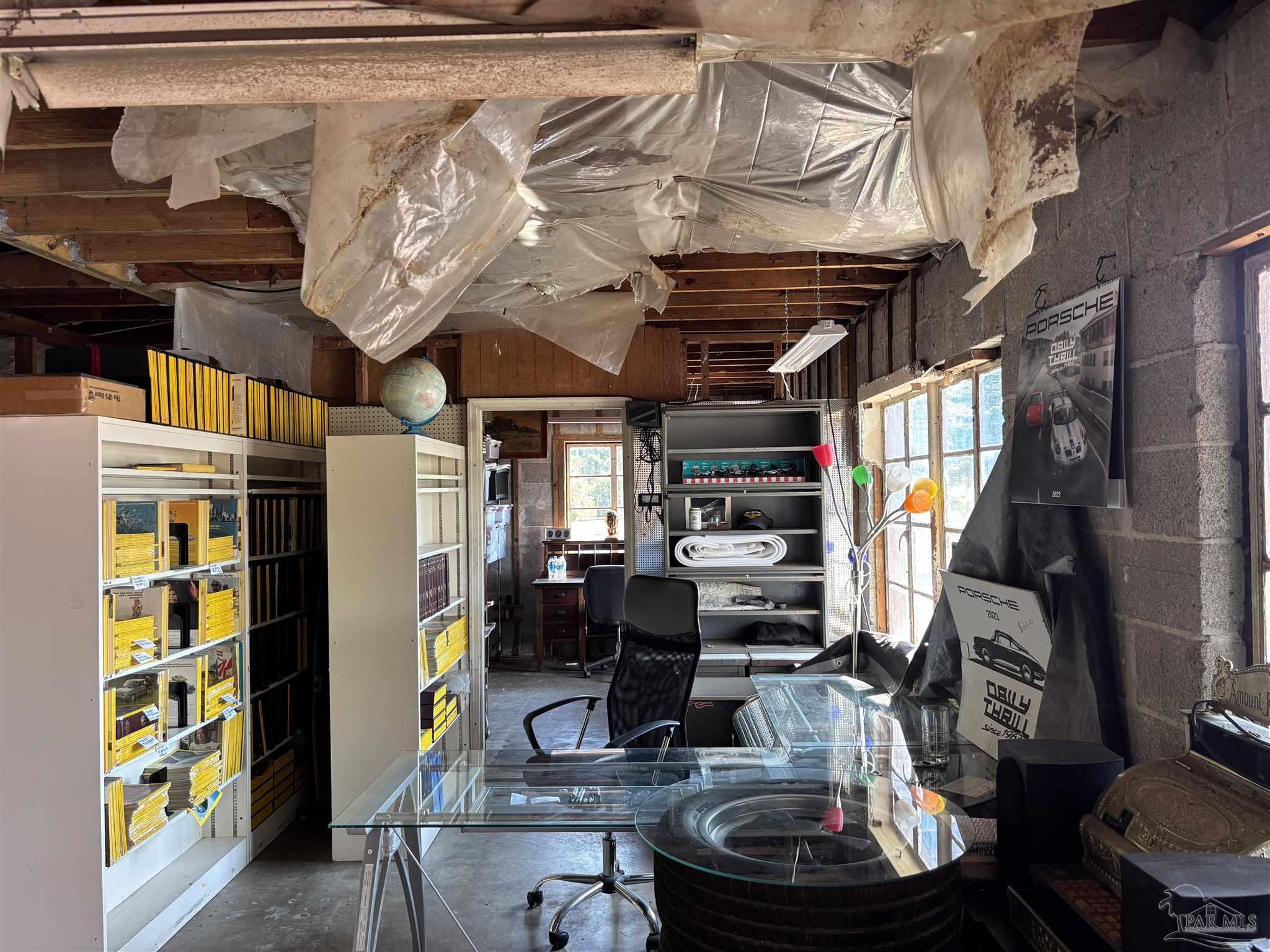 610 South Old Corry Field Road Pensacola, FL 32507 - Photo 63 of 72 a room with lots of furniture and clutter