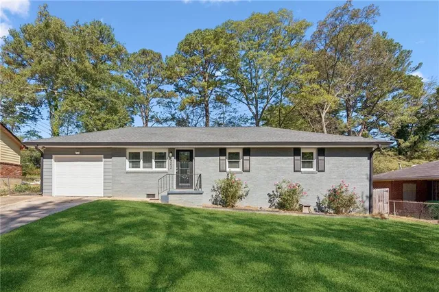 a front view of house with yard and green space