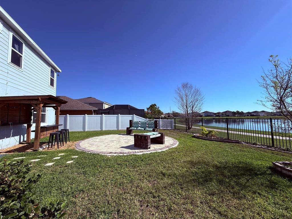 14112 Poke Ridge Drive Riverview, FL 33579 - Photo 23 of 32 a backyard of a house with table and chairs