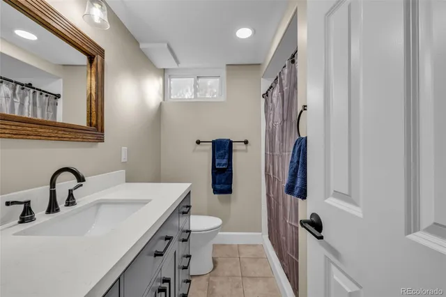 a bathroom with a sink and mirror
