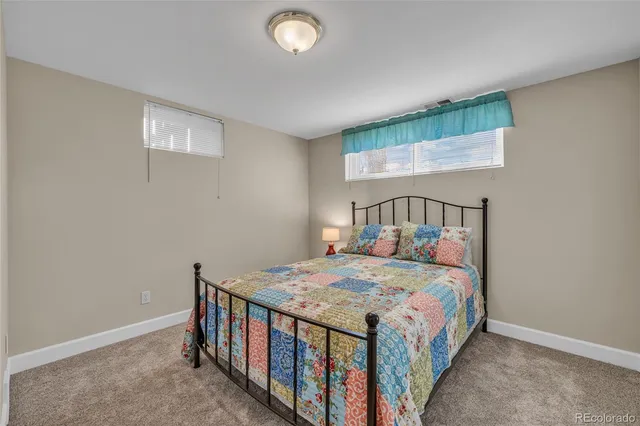 a bedroom with a bed and a table