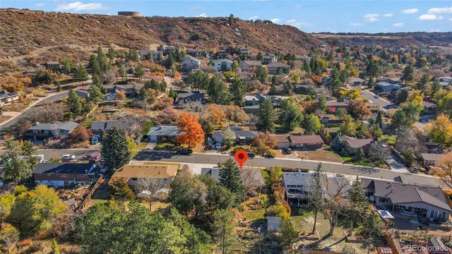 an aerial view of residential houses with outdoor space