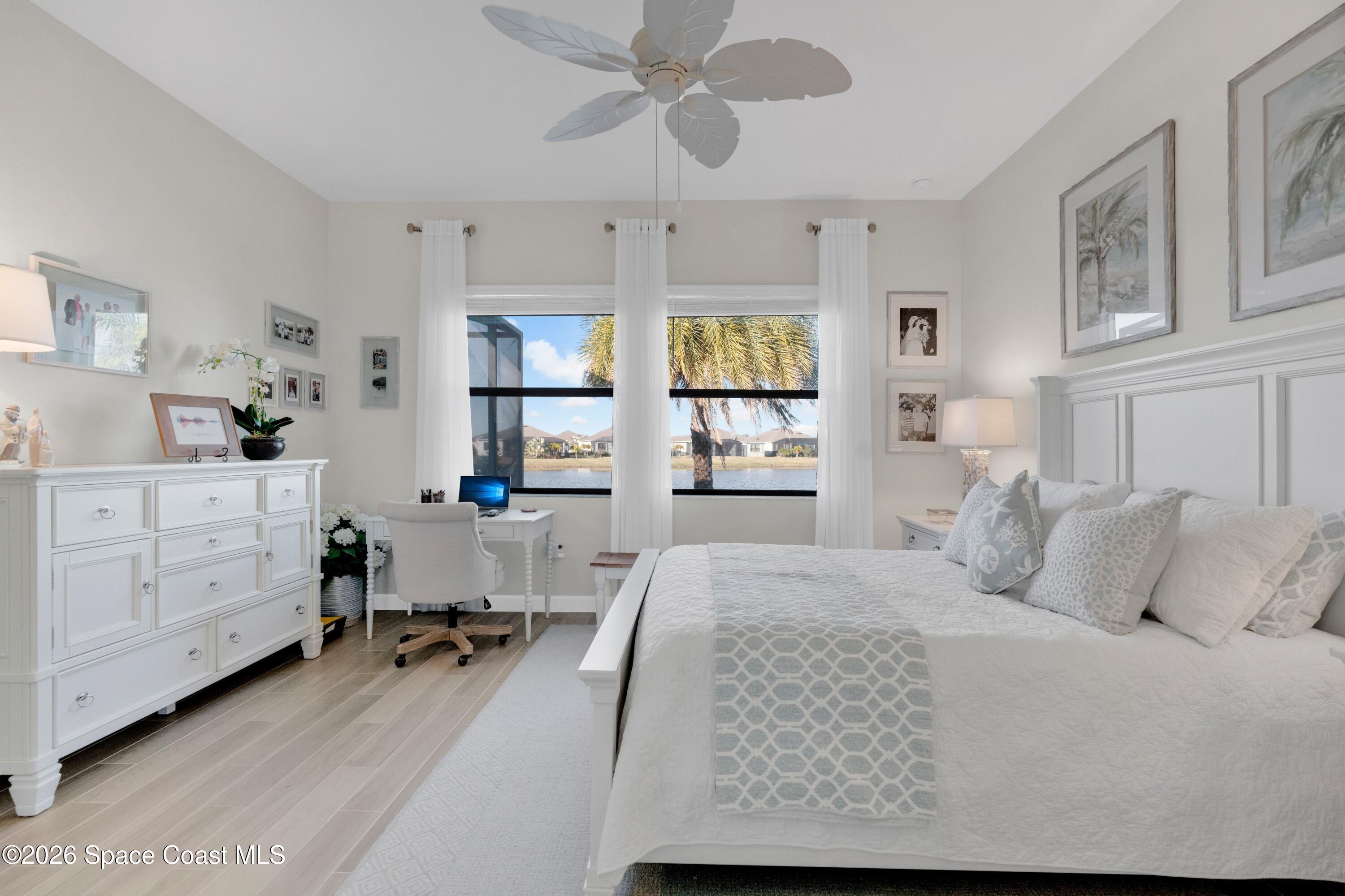 2819 Millennium Circle Melbourne, FL 32940 - Photo 12 of 39 a bedroom with a bed and a cabinets