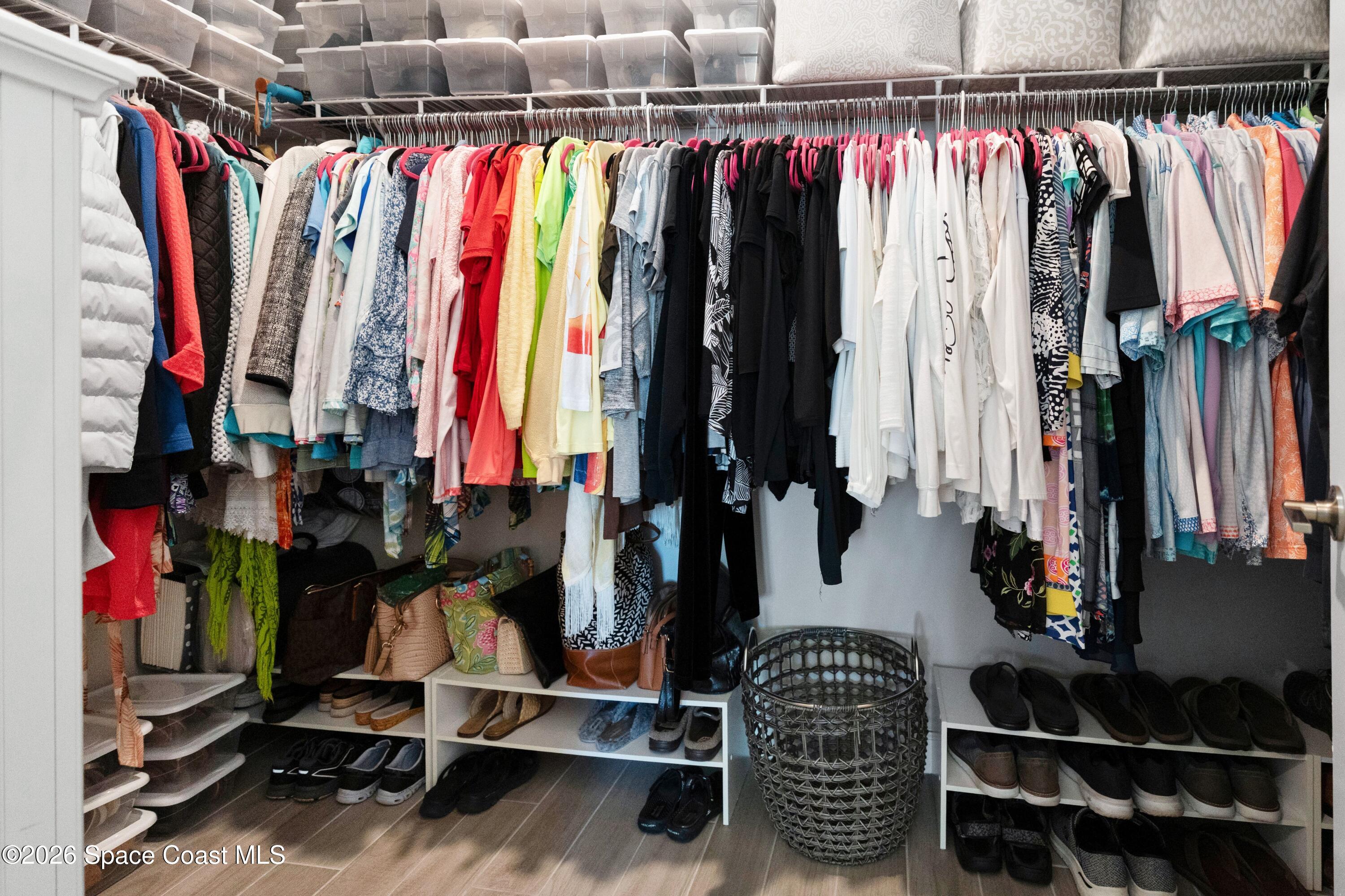 2819 Millennium Circle Melbourne, FL 32940 - Photo 17 of 39 a view of walk in closet with clothes and shoes