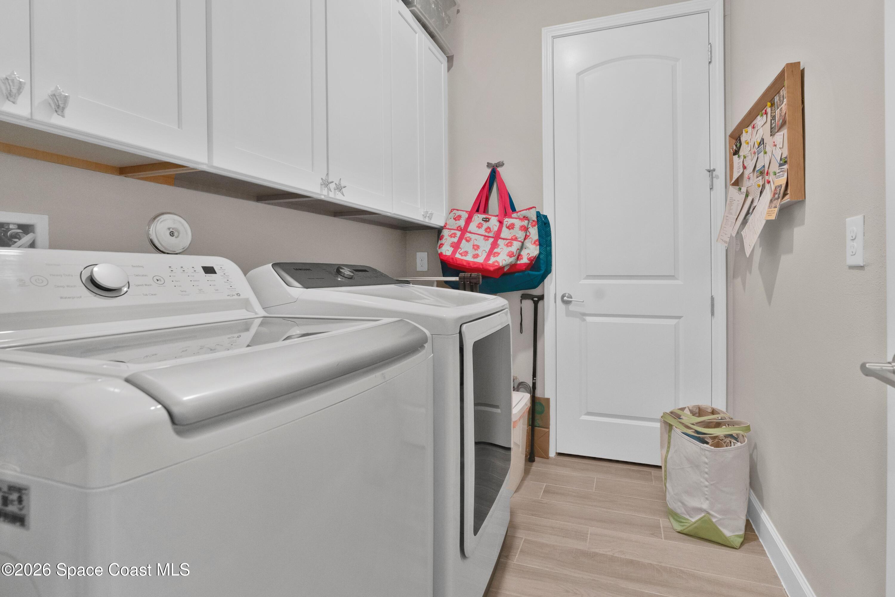 2819 Millennium Circle Melbourne, FL 32940 - Photo 22 of 39 a utility room with dryer and washer