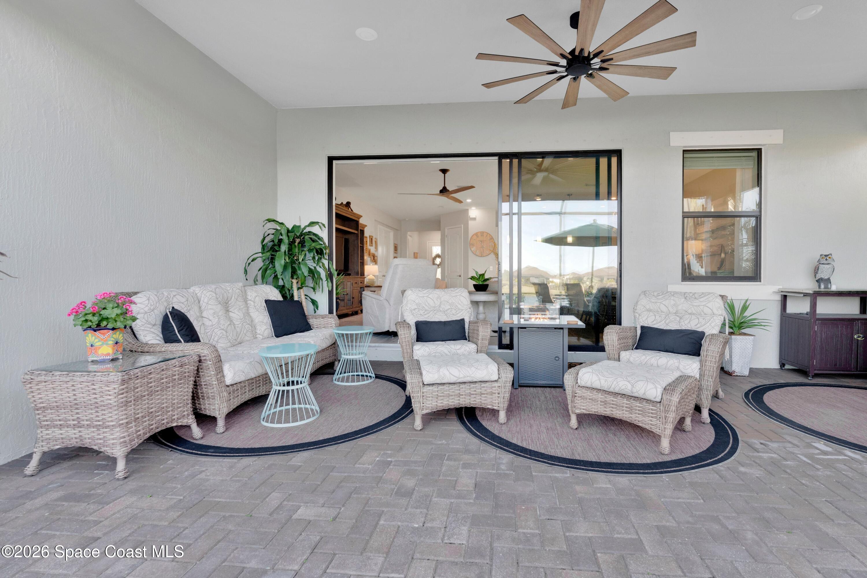 2819 Millennium Circle Melbourne, FL 32940 - Photo 24 of 39 a living room with furniture and a large window