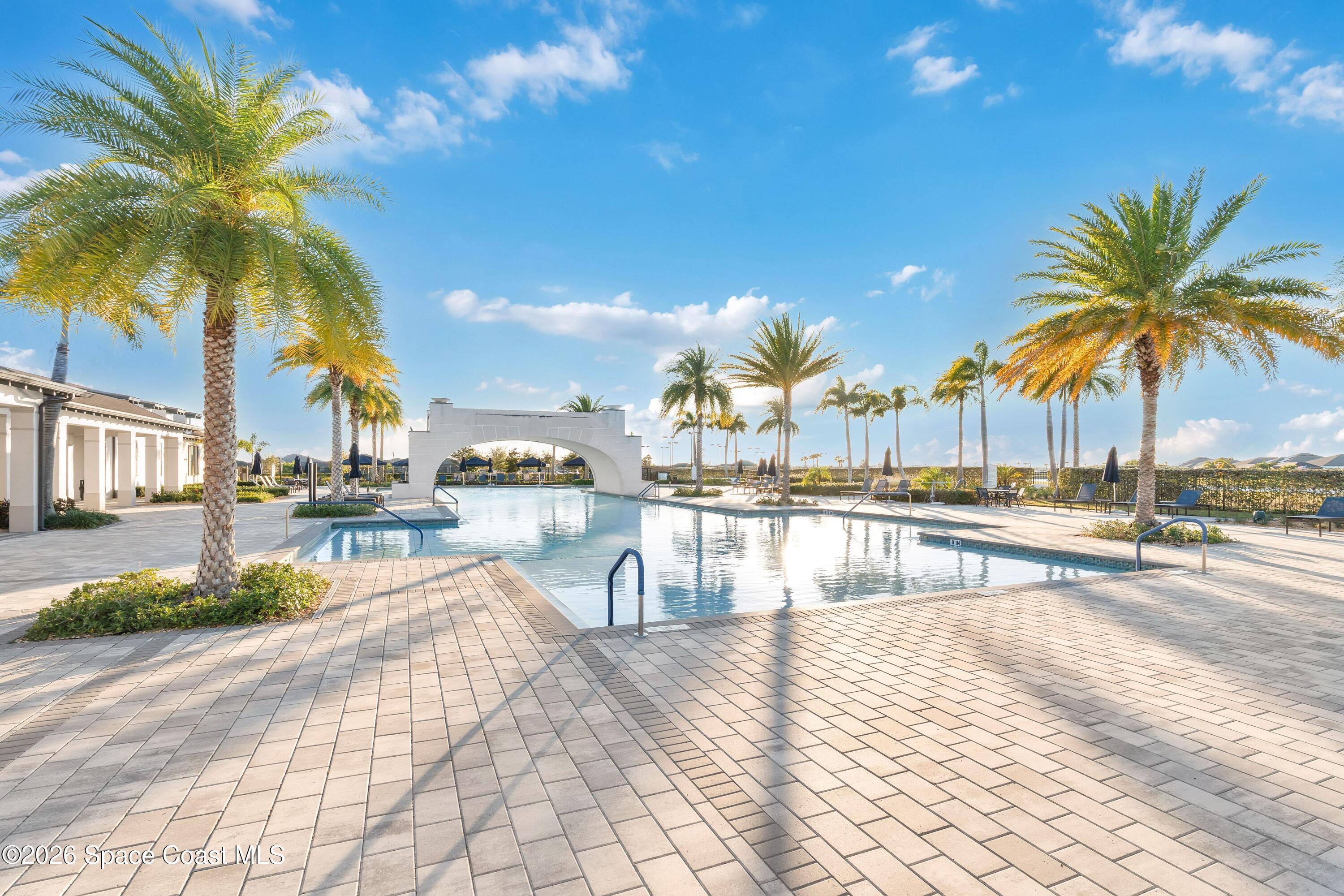 2819 Millennium Circle Melbourne, FL 32940 - Photo 27 of 39 a view of swimming pool with outdoor seating and city view
