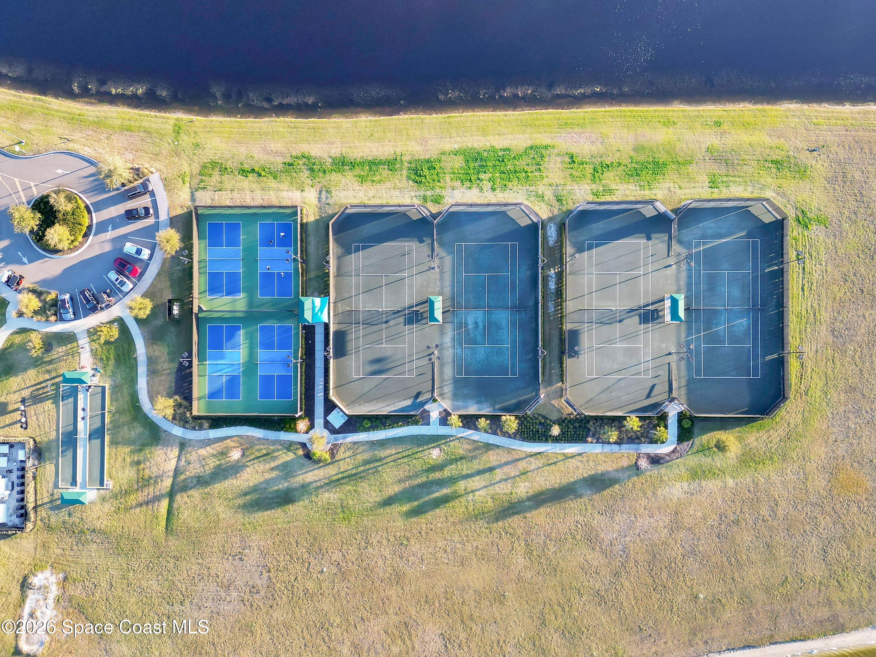 2819 Millennium Circle Melbourne, FL 32940 - Photo 36 of 39 a view of an ocean with a floor to ceiling window and an outdoor seating