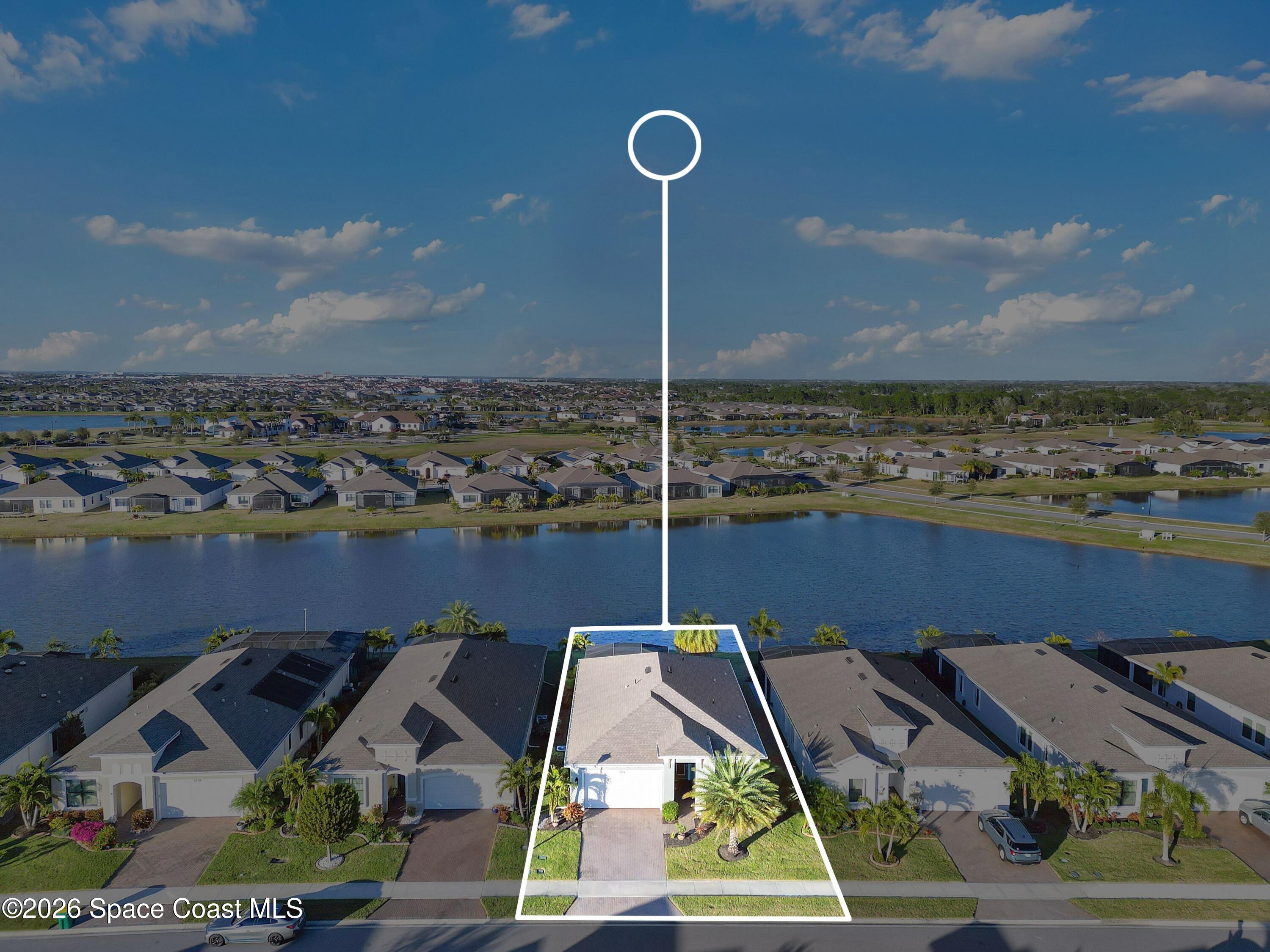 2819 Millennium Circle Melbourne, FL 32940 - Photo 38 of 39 a aerial view of a house with a lake