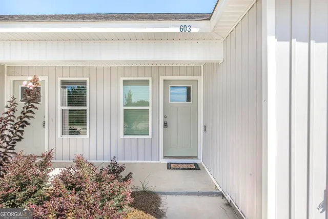 a view of a door and a window