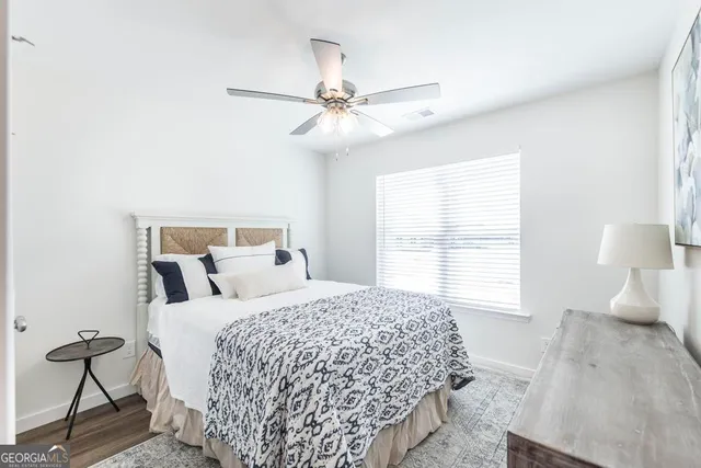 a bedroom with a bed and window