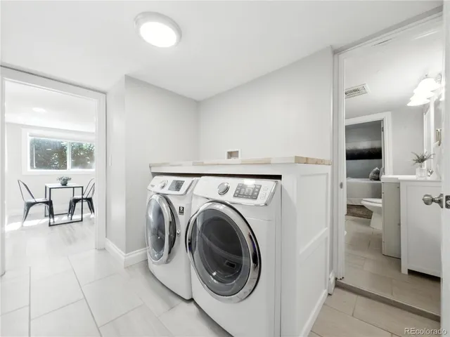 a view of a room with washer and dryer